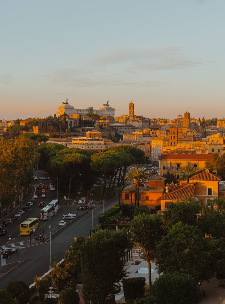 Stunning sunset view of Rome's cityscape showcasing Altare della Patria and urban landscape.