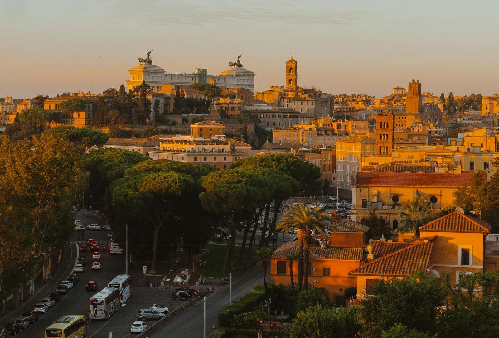 Stunning sunset view of Rome's cityscape showcasing Altare della Patria and urban landscape.