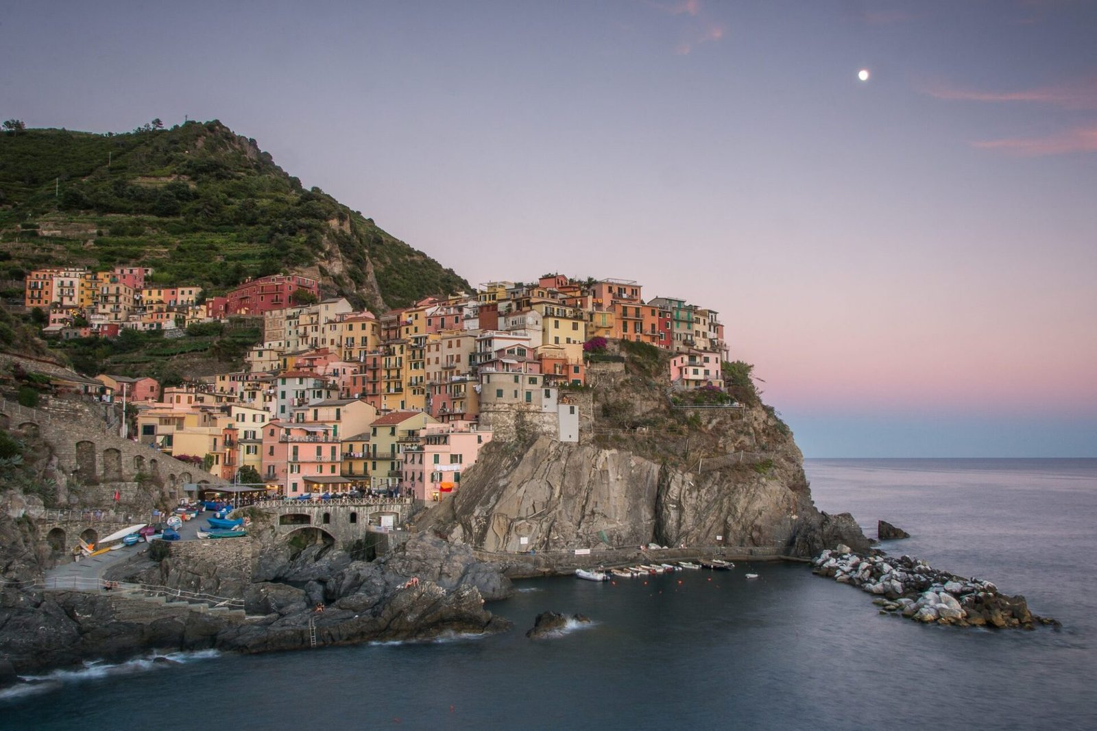 Cinque Terre Photoshoot & Proposal Guide: Manarola, Vernazza, Riomaggiore Manarola village lit up at blue hour, Cinque Terre