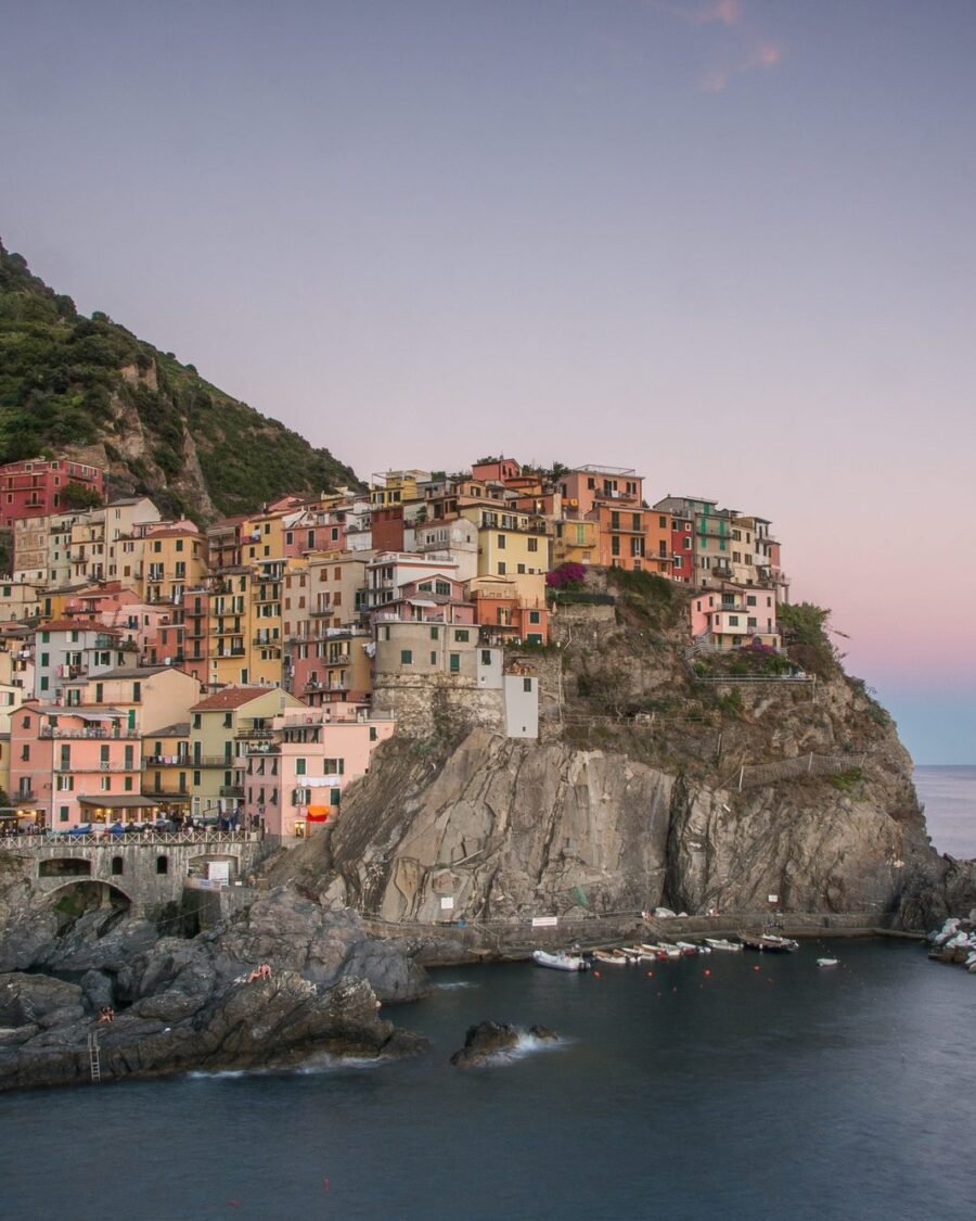 Manarola village lit up at blue hour, Cinque Terre