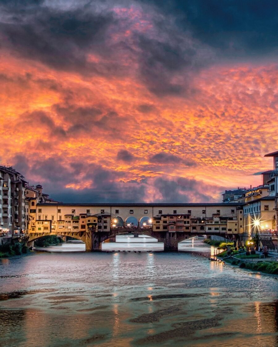 Ponte Vecchio and the Arno at sunset in Florence, seen from Ponte Santa Trinita