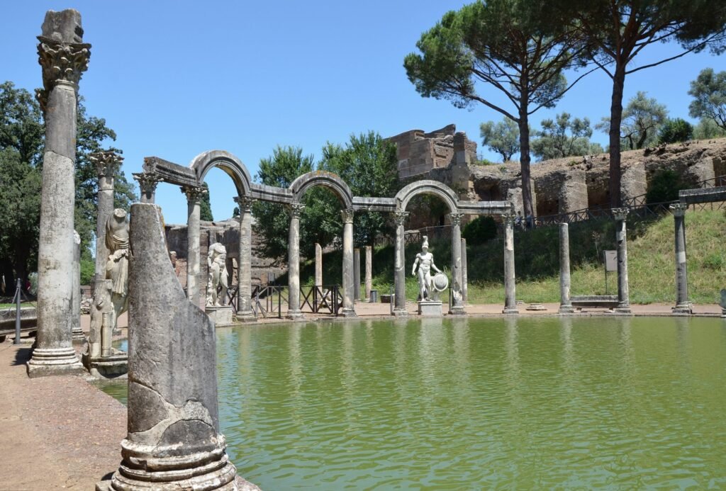 Villas in Rome for Photoshoots & Weddings: 11 Historic Estates (and How to Book Them) The Canopus pool with columns, arches and statues at Hadrian’s Villa in Tivoli