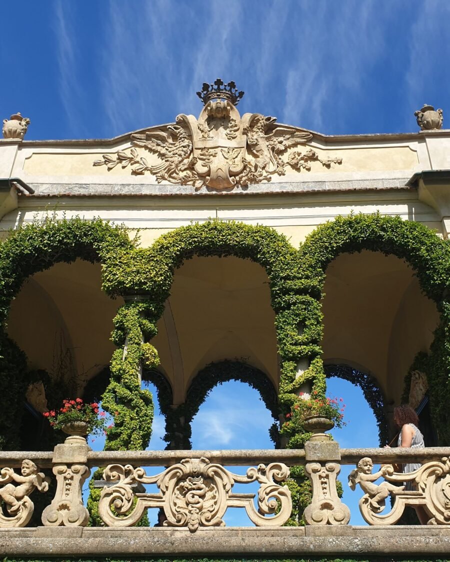 The ivy-covered loggia of Villa del Balbianello with open arches over Lake Como