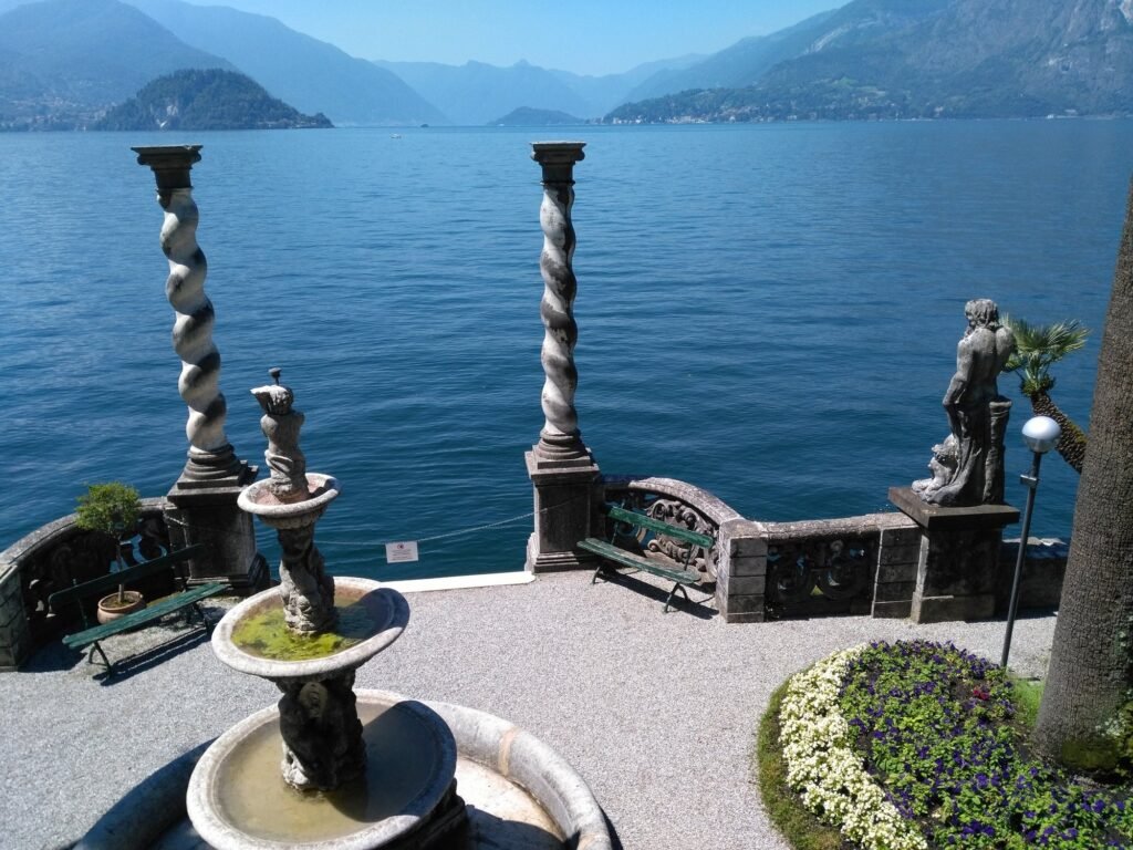 Lake Como Villas for Weddings & Photoshoots: Balbianello, Carlotta, Villa d’Este and More The terrace of Villa Monastero in Varenna with twisted columns and a fountain above Lake Como