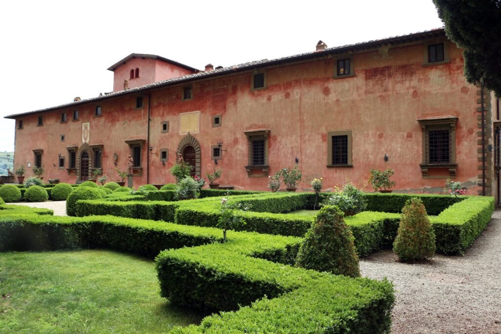 The rose-coloured façade and Italian box garden of Villa Vignamaggio in Chianti